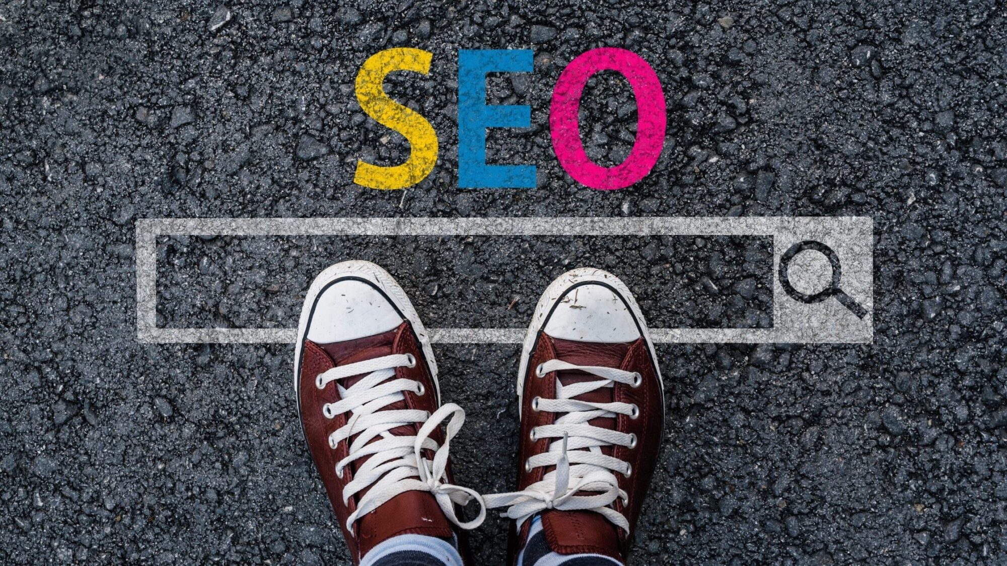 A pair of converse in front of the word SEO.