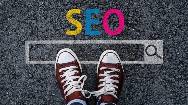 A pair of converse in front of the word SEO.